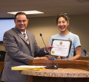 Rocio Jacobo receives certificate of recognition for Family Awareness Day promoting healthy living programs in the city from Mayor Adam Sanchez